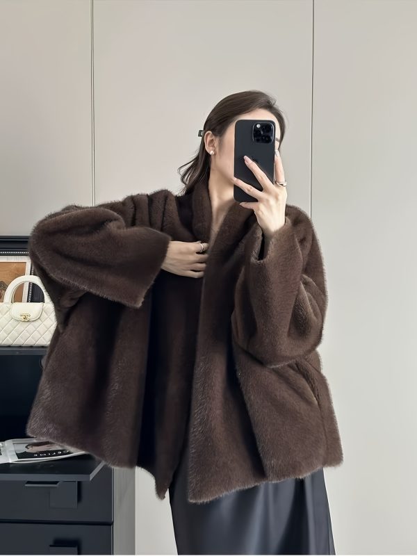 loose, casual, mink like faux fur coat for women, perfect for autumn and winter. this elegant outerwear is ideal for festive parties and stylish, sophisticated outfits.