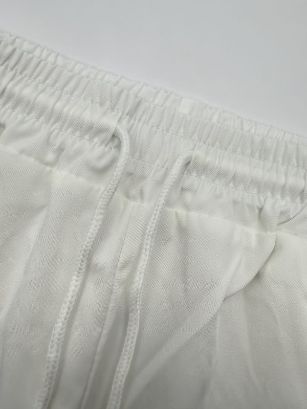 new products in 2025, a two piece set of simple men's short sleeved shirts and long pants for summer. it comes in a black and white color scheme, with a casual and stylish style, suitable for occasions such as daily outings and casual gatherings.