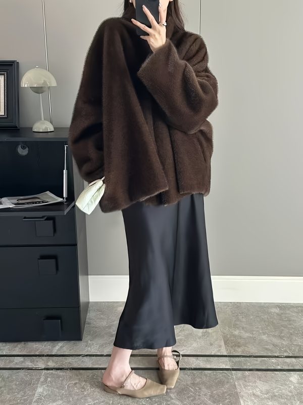 loose, casual, mink like faux fur coat for women, perfect for autumn and winter. this elegant outerwear is ideal for festive parties and stylish, sophisticated outfits.