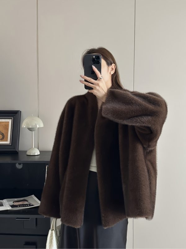loose, casual, mink like faux fur coat for women, perfect for autumn and winter. this elegant outerwear is ideal for festive parties and stylish, sophisticated outfits.