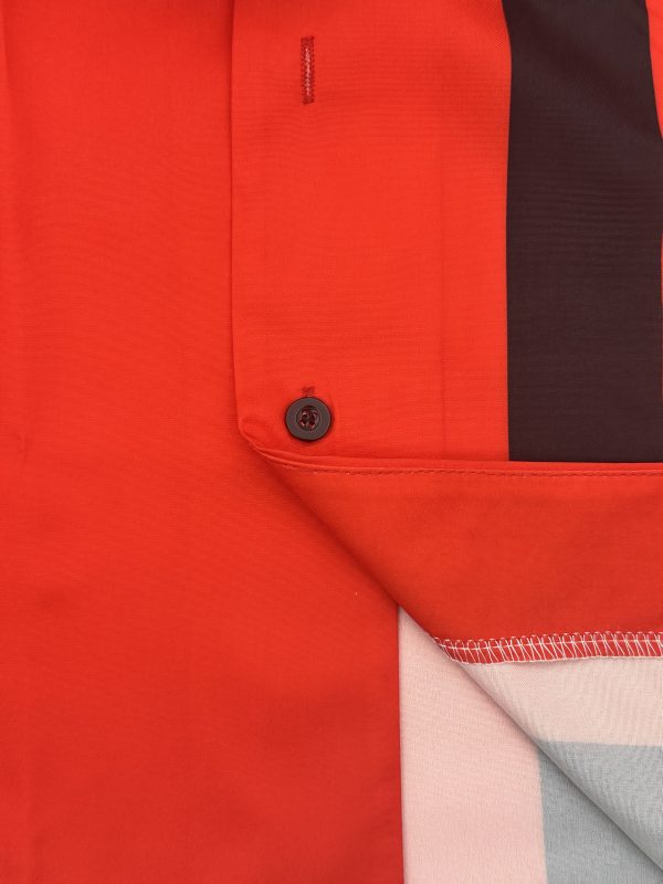 new products in 2025, a two piece set consisting of a simple cuban collar long sleeved men's shirt and long pants. the set features an artistic black and red color blocking style, suitable for casual wear, vacations, and daily outings.