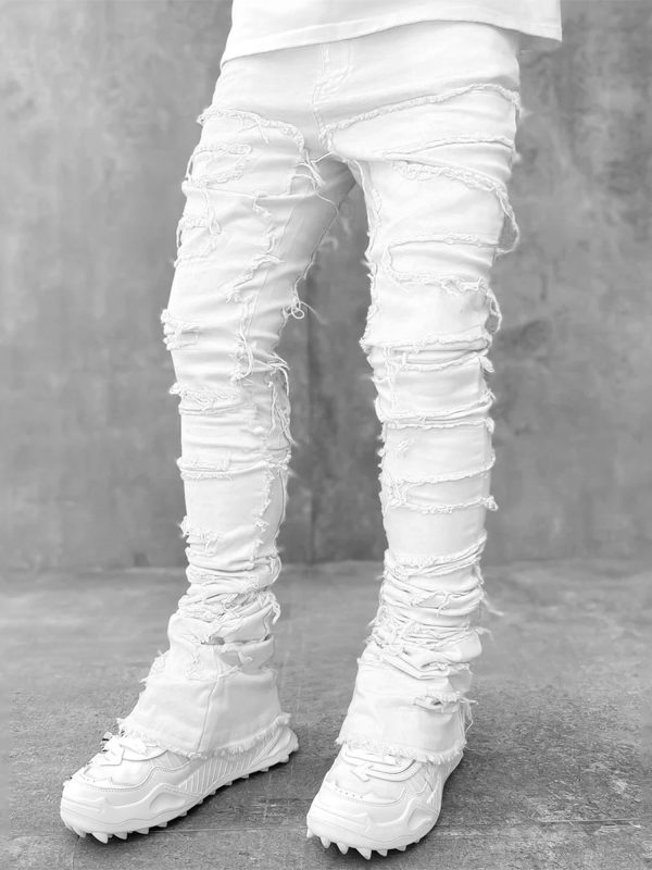 men's slim fit vintage patched distressed denim trousers for casual wear in spring and fall, featuring pockets.